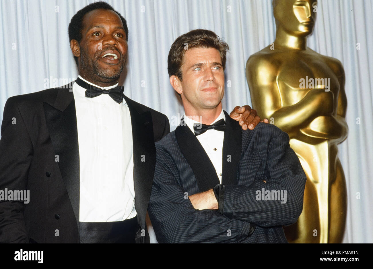 Danny Glover and Mel Gibson at the 60th Annual Academy Wards 1988 © JRC
