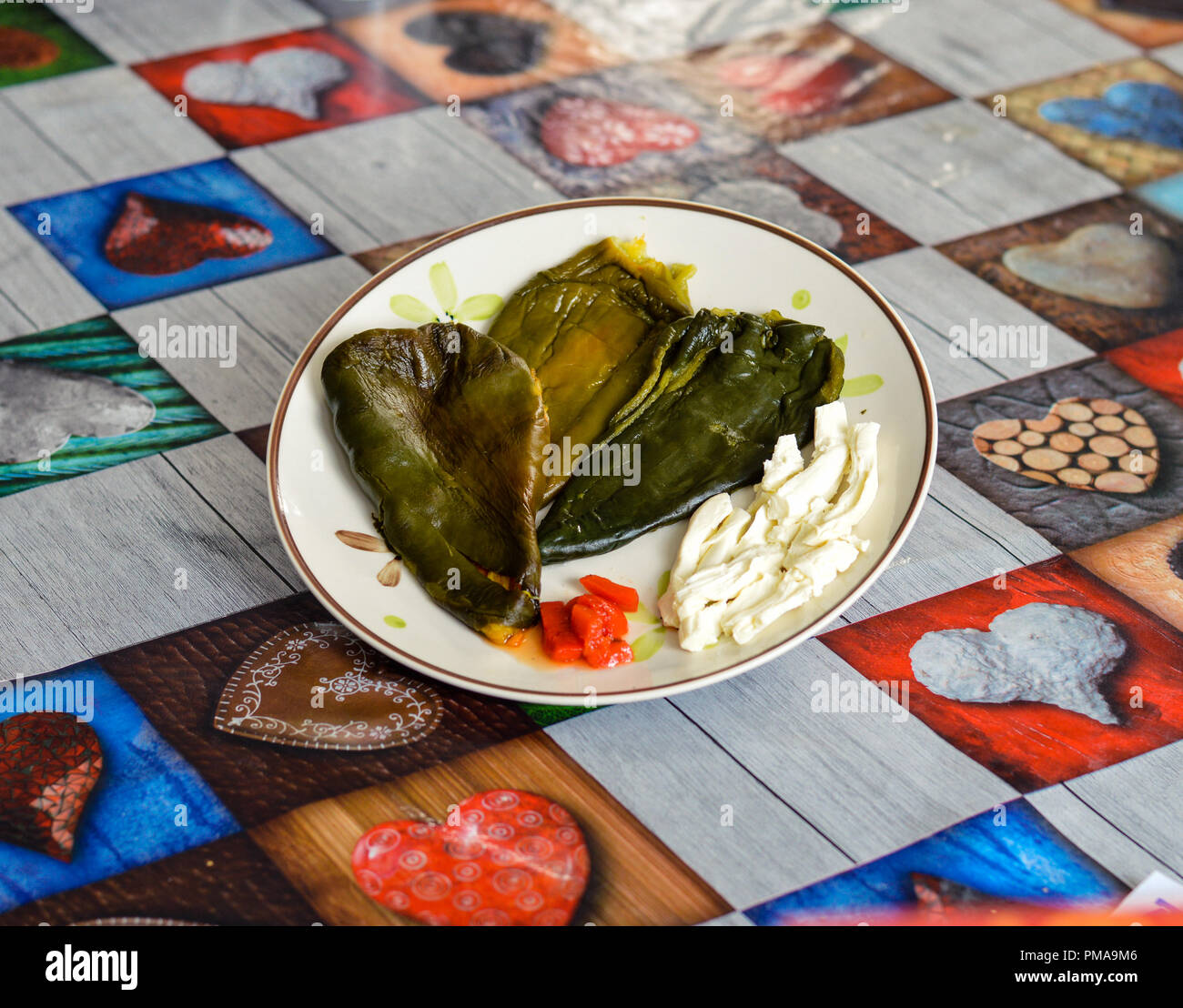 Poblano peppers  for chiles rellenos, stuffed chillies, along with oaxaca cheese Stock Photo