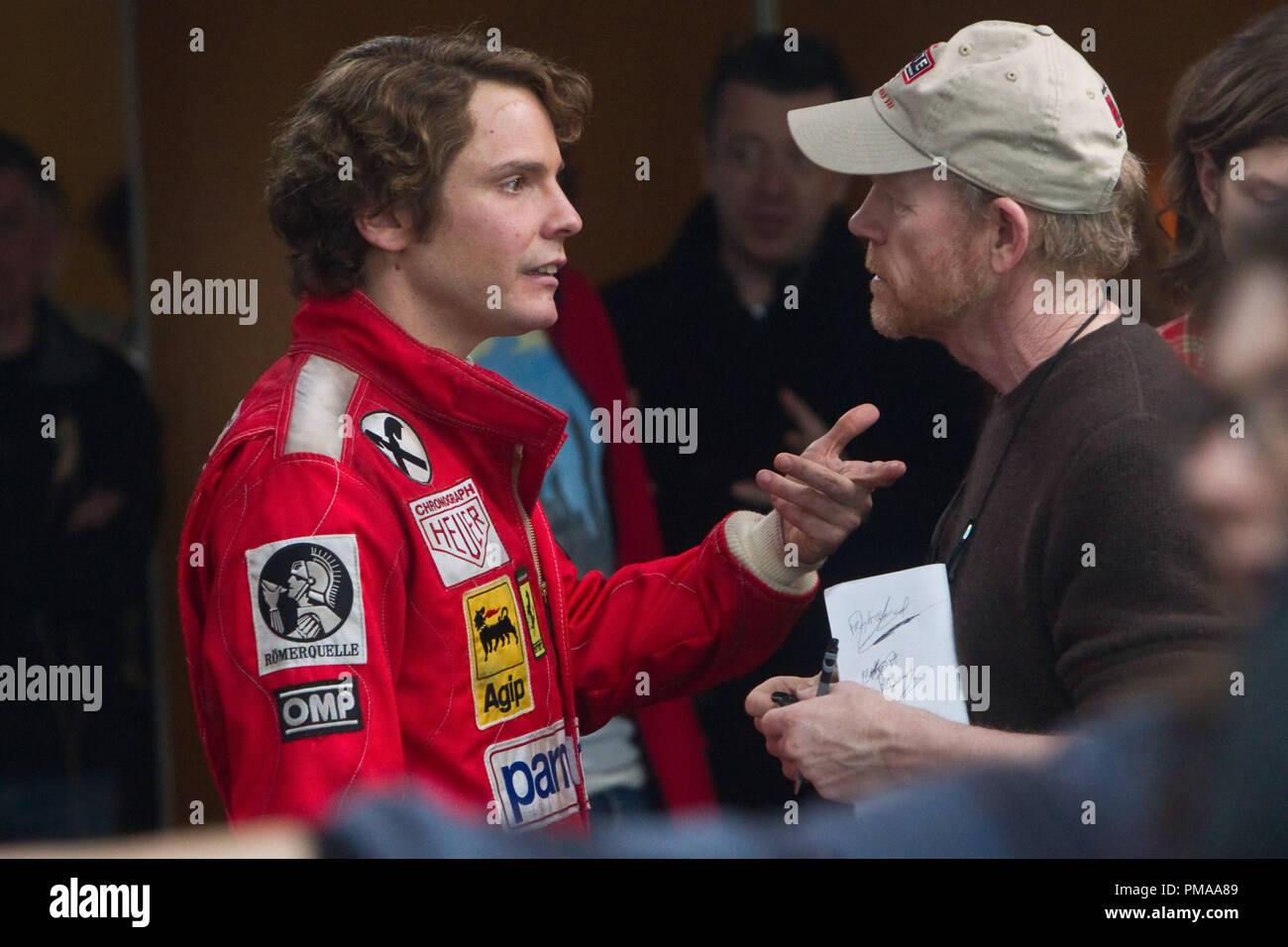 L to R) DANIEL BRUHL as disciplined Austrian perfectionist Niki Lauda and  two-time Academy Award winner RON HOWARD on the set of "Rush Stock Photo -  Alamy