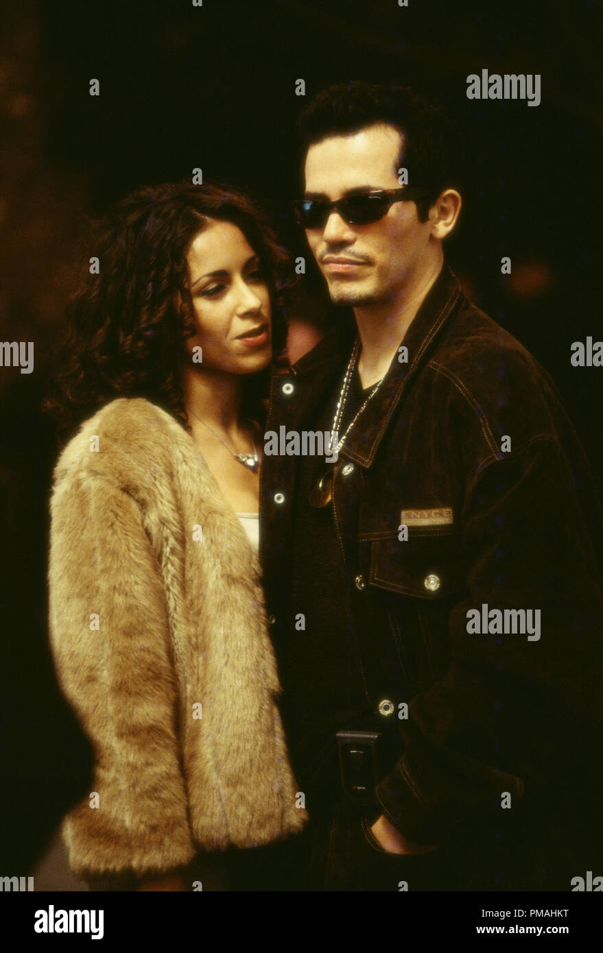 Victor (JOHN LEGUIZAMO) and his girl Carmen (DELILAH COTTO) are living the good life. 'Empire Two Worlds Collide' (2002) Stock Photo