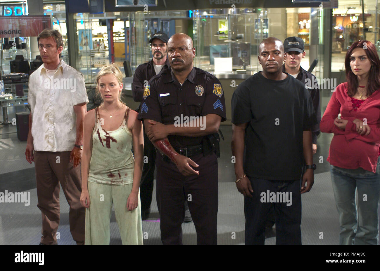 L To R Michael Jake Weber Ana Sarah Polley Cj Michael Kelly Kenneth Ving Rhames Andre Mekhi Phifer Terry Kevin Zegers And Luda Inna Korobkina Survey The Aftermath Of A Mall Breach