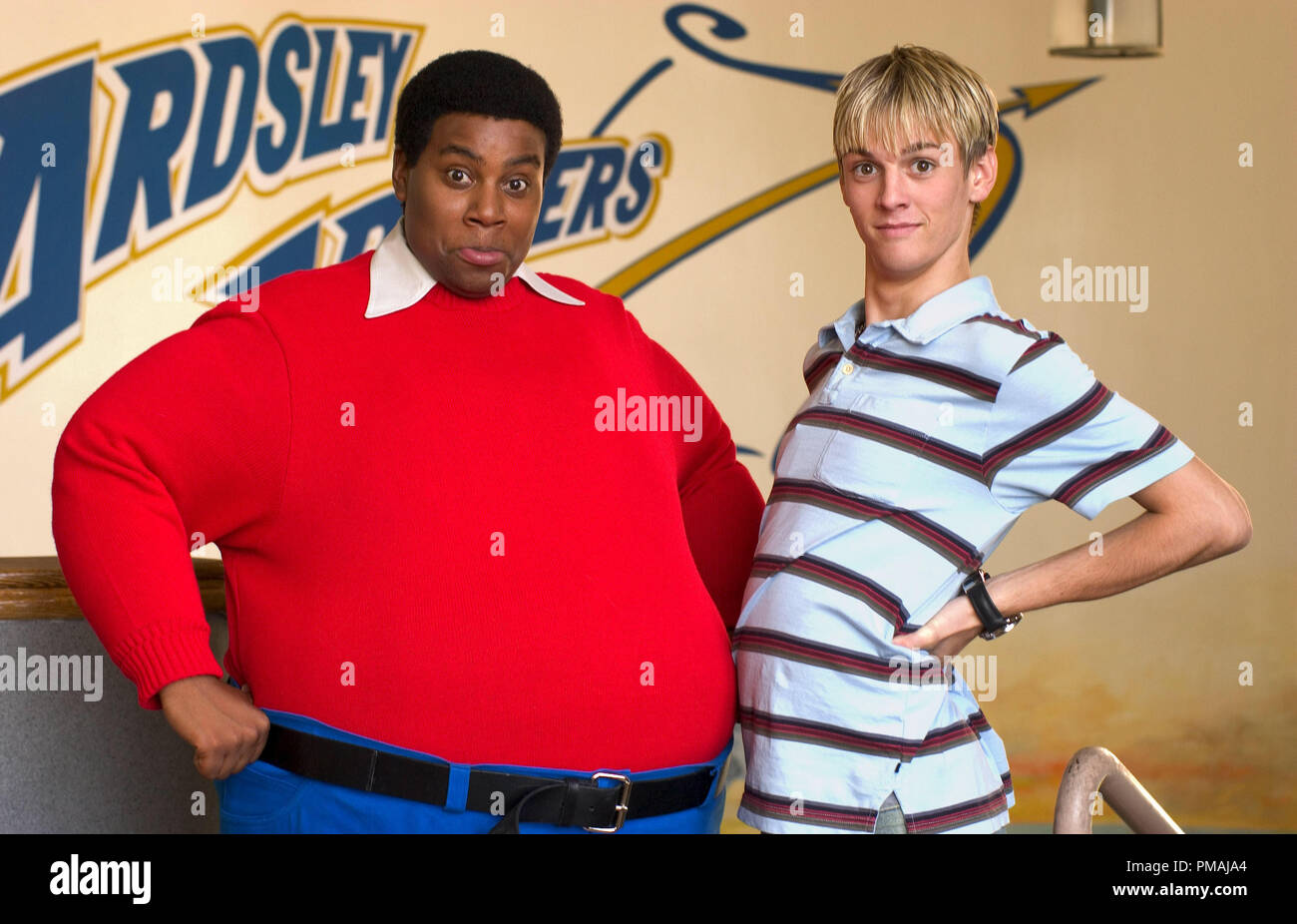 Fat Albert (Kenan Thompson) makes a 'big' impression with one of his schoolmates (singer Aaron Carter). 'Fat Albert' (2004) Stock Photo