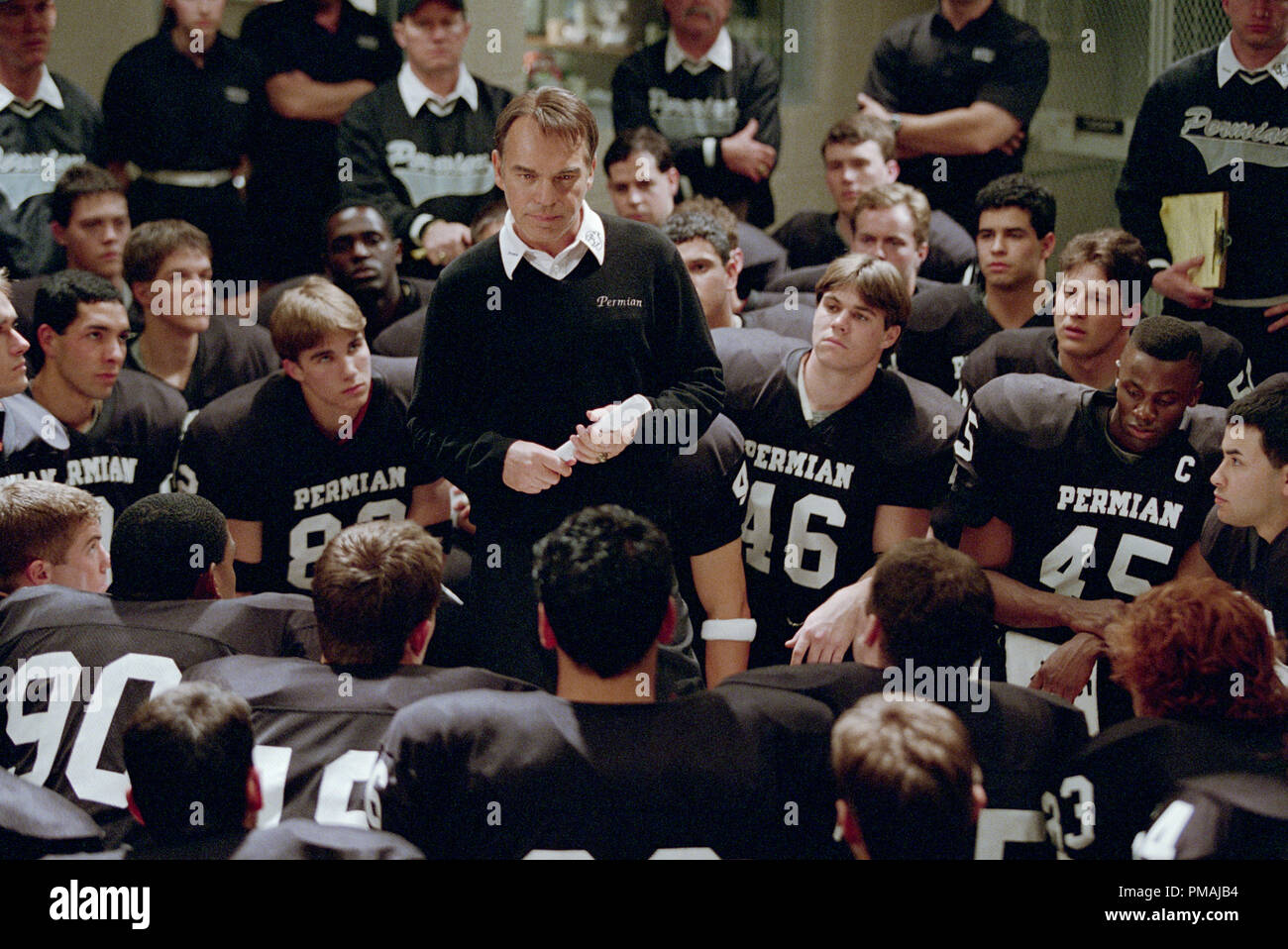 Coach Gary Gaines (BILLY BOB THORNTON) motivates his team in the locker room before a game in Imagine Entertainment's adaptation of H.G. Bissinger's prize-winning book, Friday Night Lights. (2004) Stock Photo