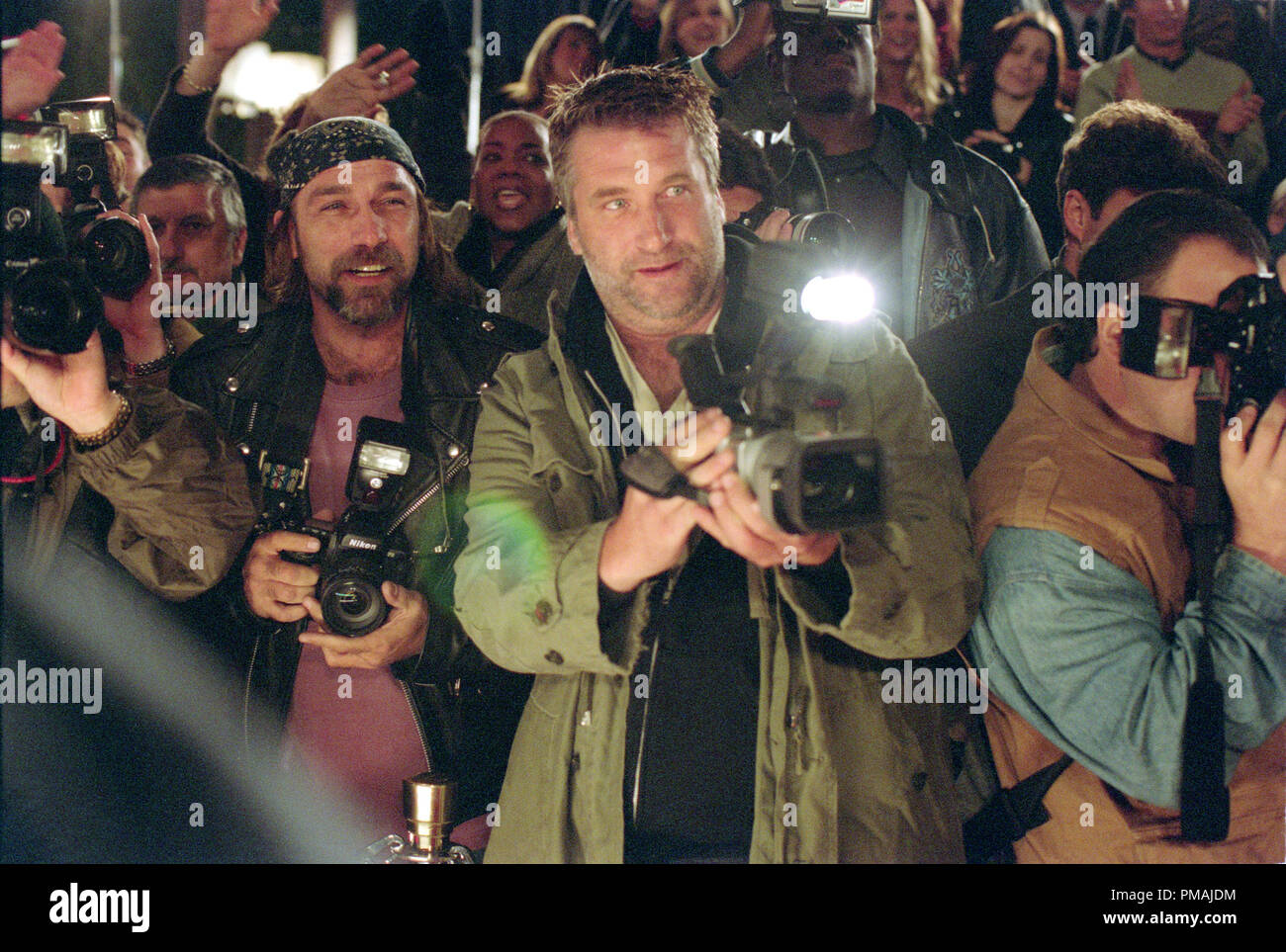 Paparazzo Wendell Stokes (Daniel Baldwin) (center) eagerly awaits the arrival of his 'prey': Hollywood action star Bo Laramie. 'Paparazzi' (2004) Stock Photo