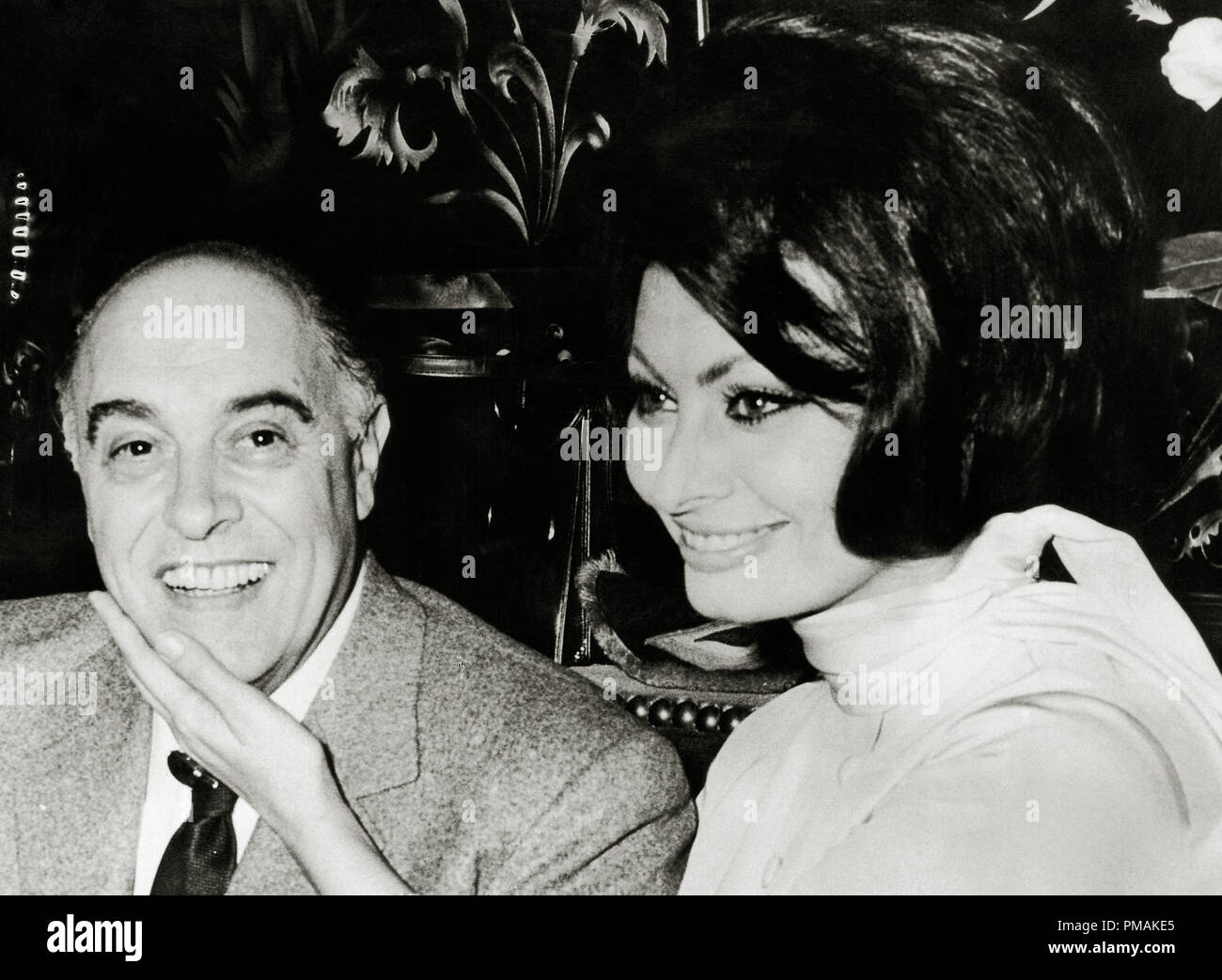 Producer Carlo Ponti with his wife, Sophia Loren in Paris after their wedding,1966 File Reference # 33300_451THA Stock Photo