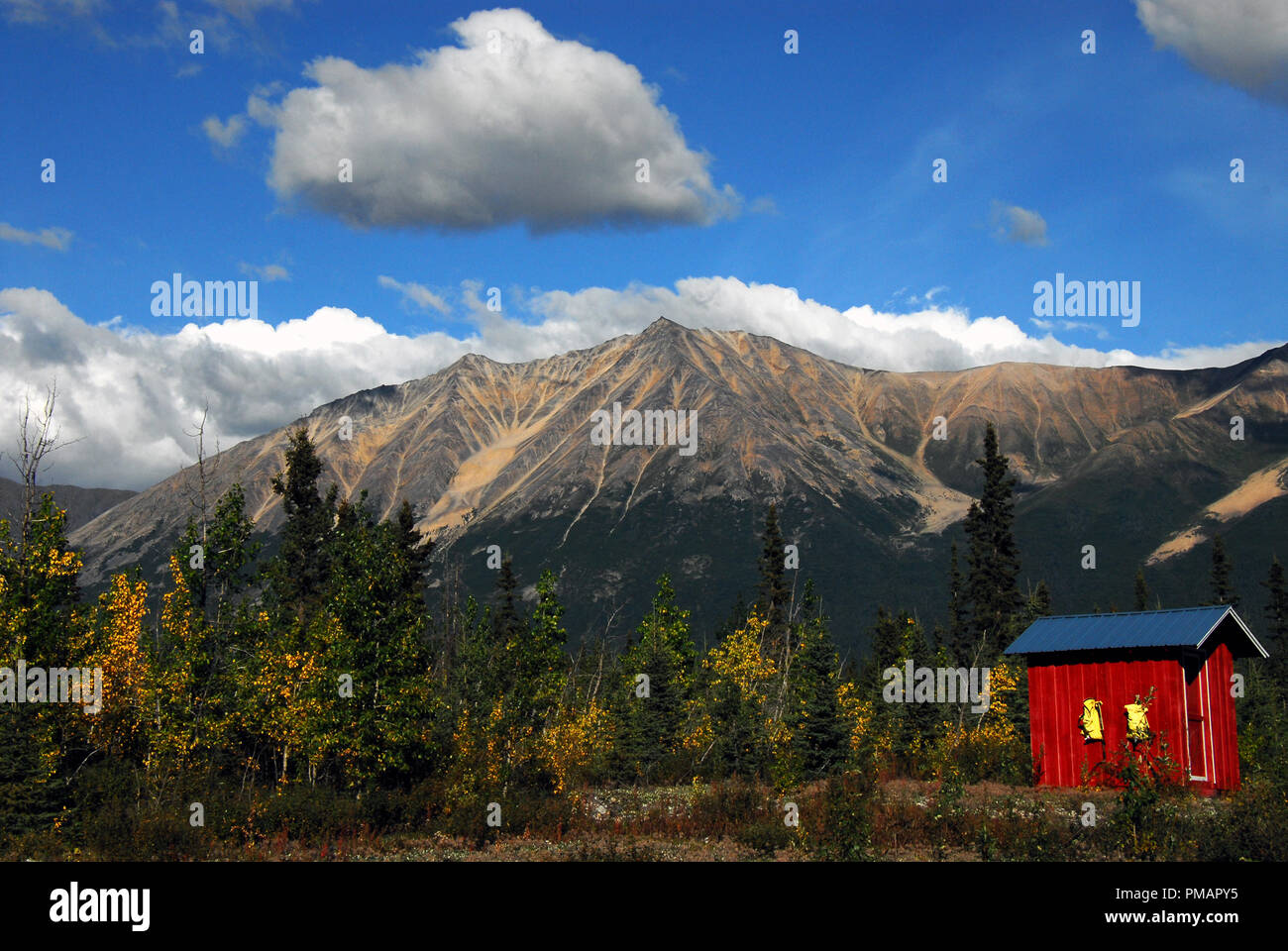 A wonderful panorama of the beautiful landscape along the McCarthy Road- Wrangell National Park in Alaska.  Note the colorful emergency shed. Stock Photo