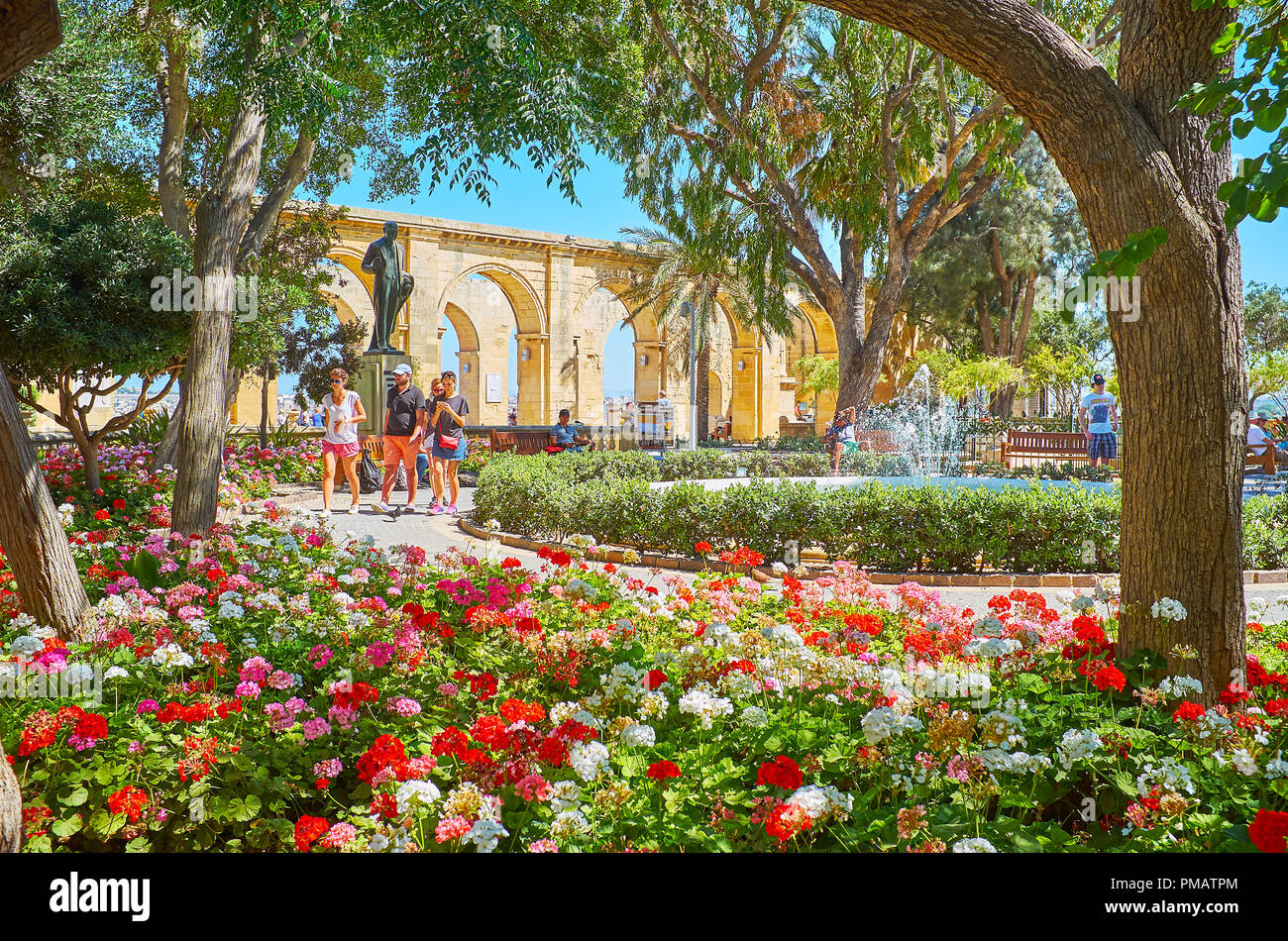 VALLETTA, MALTA - JUNE 17, 2018: The flower beds in picturesque Upper Barrakka gardens, famous tourist place, located on upper tier of St Peter and Pa Stock Photo