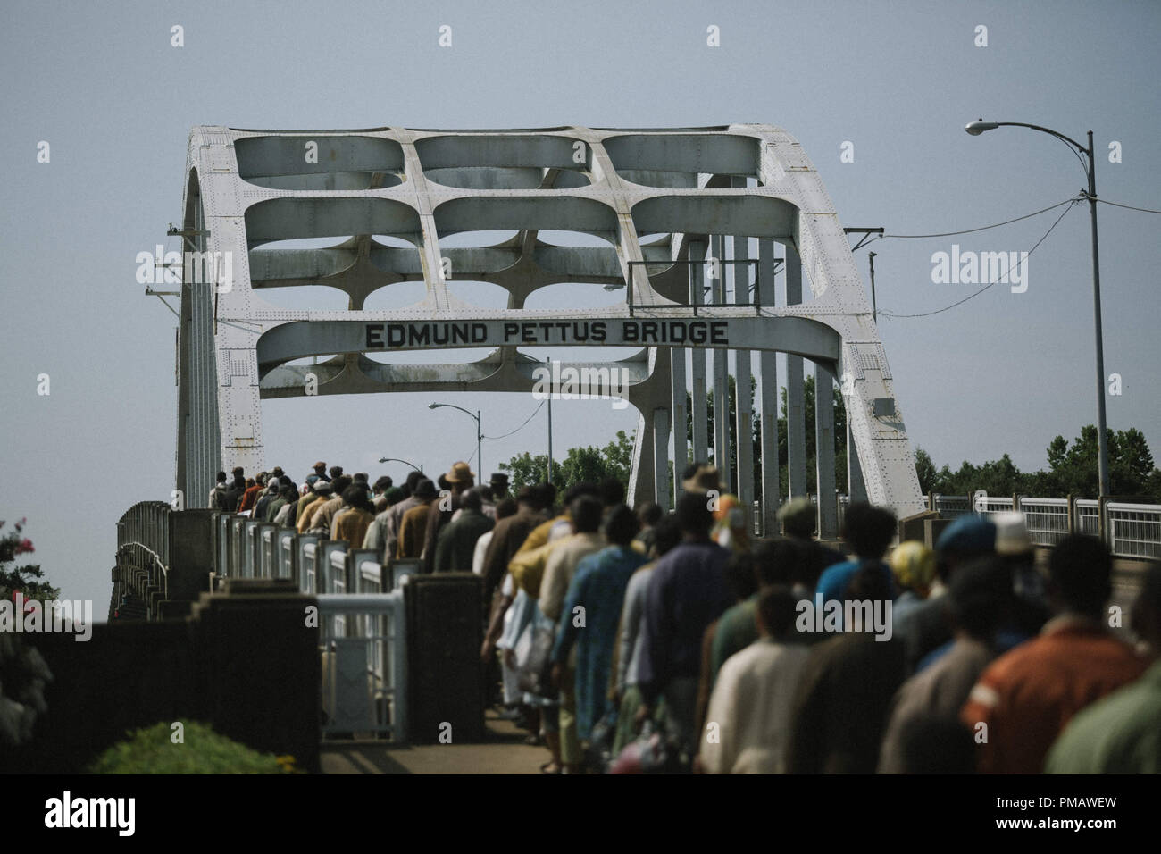 Marchers cross the Edmund Pettus Bridge in SELMA, from Paramount Pictures, Pathé, and Harpo Films. Stock Photo