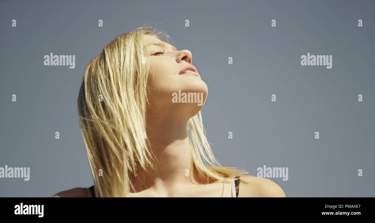 Portrait of attractive young white woman taking sun Stock Photo - Alamy
