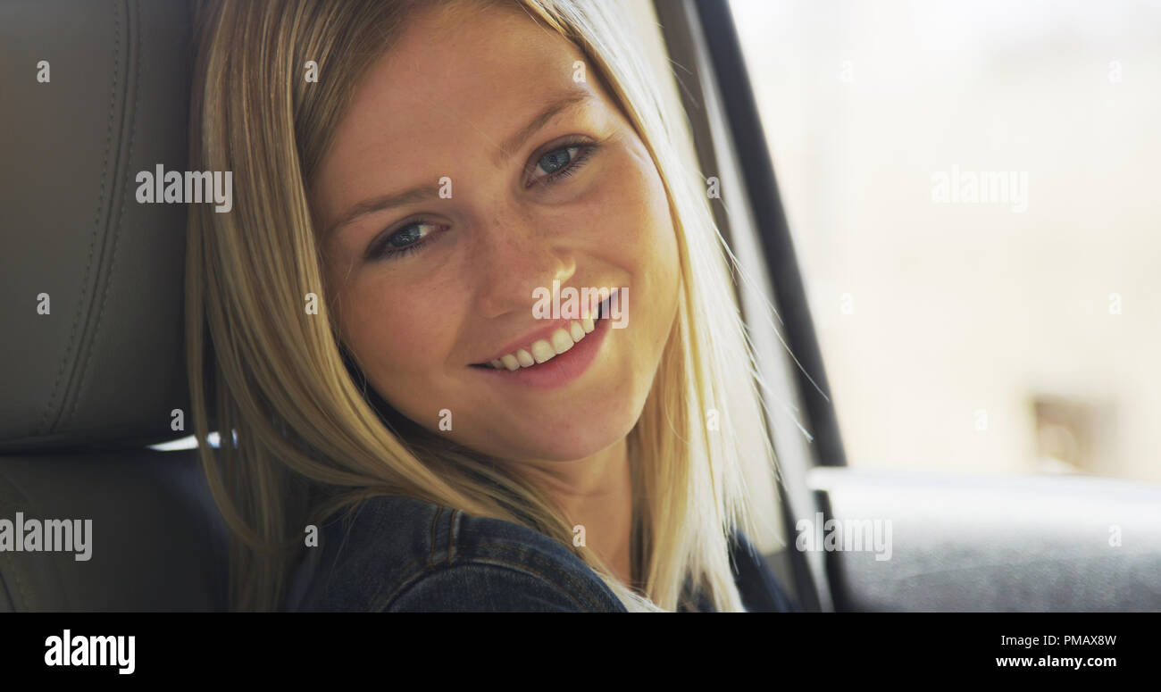 Portrait of happy caucasian girl smiling in a car Stock Photo - Alamy