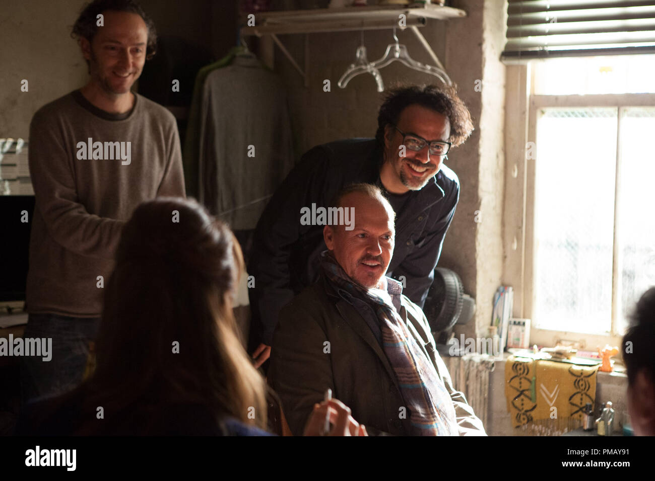 From L to R: Amy Ryan, Michael Keaton, and Director Alejandro González Iñárritu on the set of BIRDMAN. Stock Photo