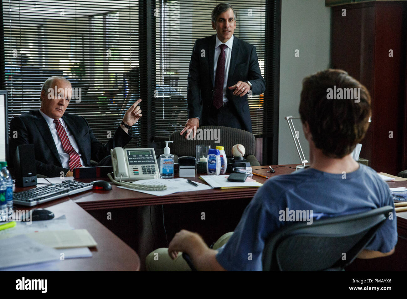 Left to right: Tracy Letts plays Lawrence Fields, Wayne Pere plays Martin Blaine and Christian Bale plays Michael Burry in The Big Short from Paramount Pictures and Regency Enterprises Stock Photo