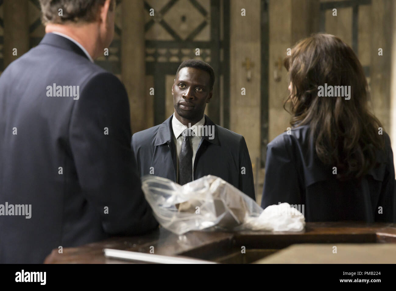 Bouchard (Omar Sy) catches up with Langdon (Tom Hanks) and Sienna (Felicity Jones) in the Baptistry in Columbia Pictures' INFERNO. Stock Photo