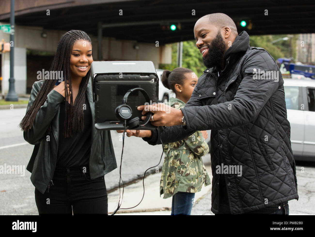 Executive producer GABRIELLE UNION as Rachel and writer/director DAVID E. TALBERT on the set of the comedy 'Almost Christmas,' the festive story of a beloved patriarch who asks his family for one gift this holiday season: to get along.  If they can honor that wish and spend five days under the same roof without killing one another, it will be a Christmas miracle. Stock Photo