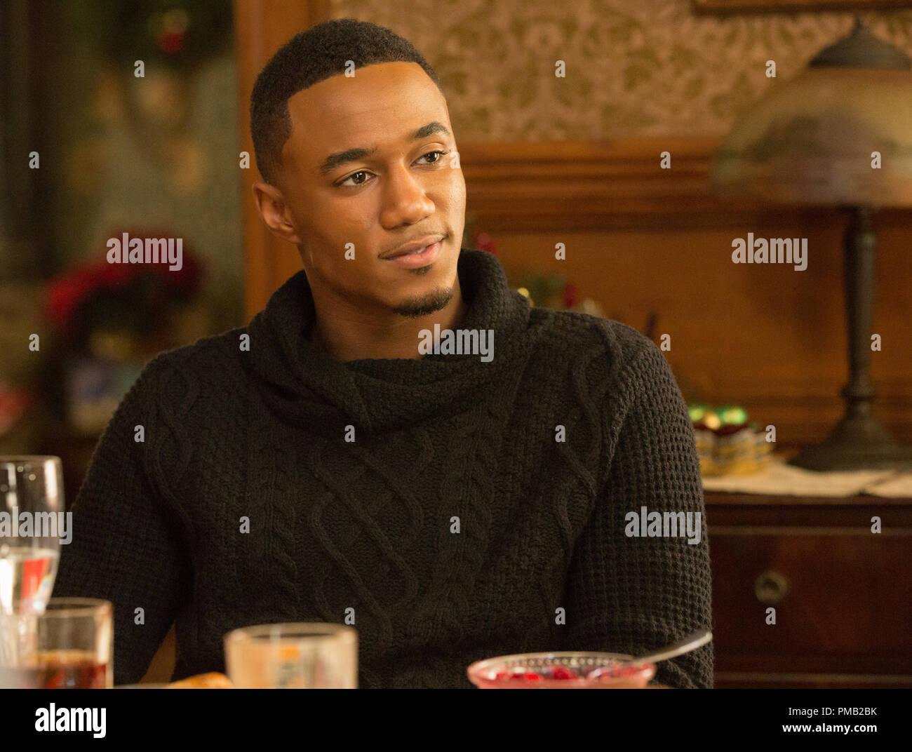 JESSIE T. USHER as Evan in 'Almost Christmas.'  The new comedy from writer/director David E. Talbert and producer Will Packer tells the festive story of a beloved patriarch who asks his family for one gift this holiday season: to get along.  If they can honor that wish and spend five days under the same roof without killing one another, it will be a Christmas miracle. Stock Photo