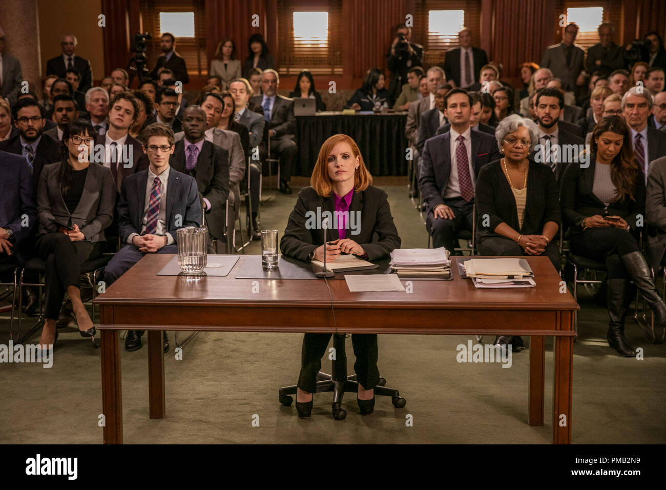 (Front row left to right) Grace Lynn Jung, Noah Robbins  (Center at desk.) star, Jessica Chastain (Second row  left to right.) Ennis Esmer, Douglas Smith, (Second row fourth to rightt.) Raoul Bhaneja and (Second row far right.) Sam Waterston stars in EuropaCorp's 'Miss Sloane'...Photo Credit: Kerry Hayes. Stock Photo