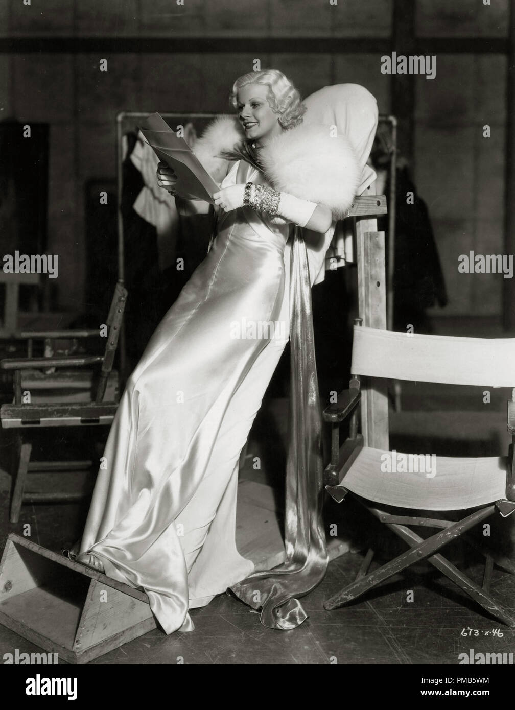 jean harlow dinner at eight dress Jean Harlow relaxes on the set of "Dinner at Eight" (1933). Her dress was so tight that she couldn't actually sit and had to rest upon the padded slant board
