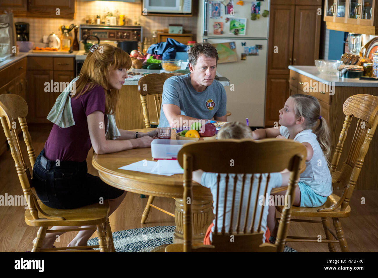 Cassie (Lane Styles, RIGHT) confesses that she punched two boys to her mom (Kelly Reilly, LEFT) and dad Todd (Greg Kinnear, CENTER) while her brother Colton (Connor Corum) looks on in TriStar Pictures' HEAVEN IS FOR REAL. Stock Photo