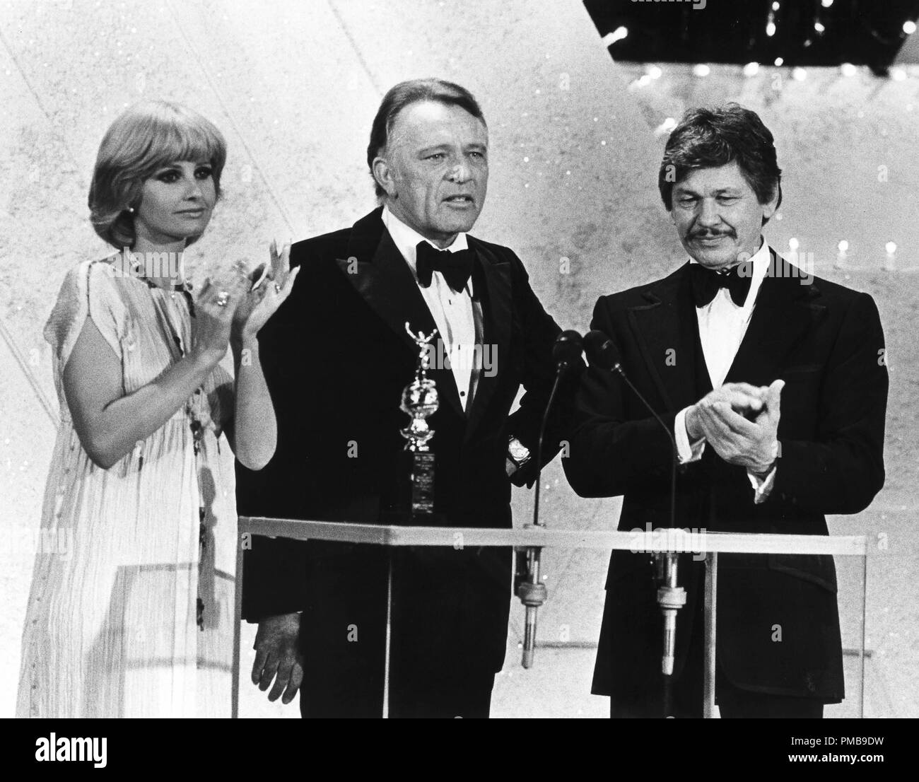 Jill Ireland, Richard Burton, Charles Bronson at the 35th Annual Golden Globe Awards, 1978 © JRC /The Hollywood Archive - All Rights Reserved File Reference # 32557 712THA Stock Photo