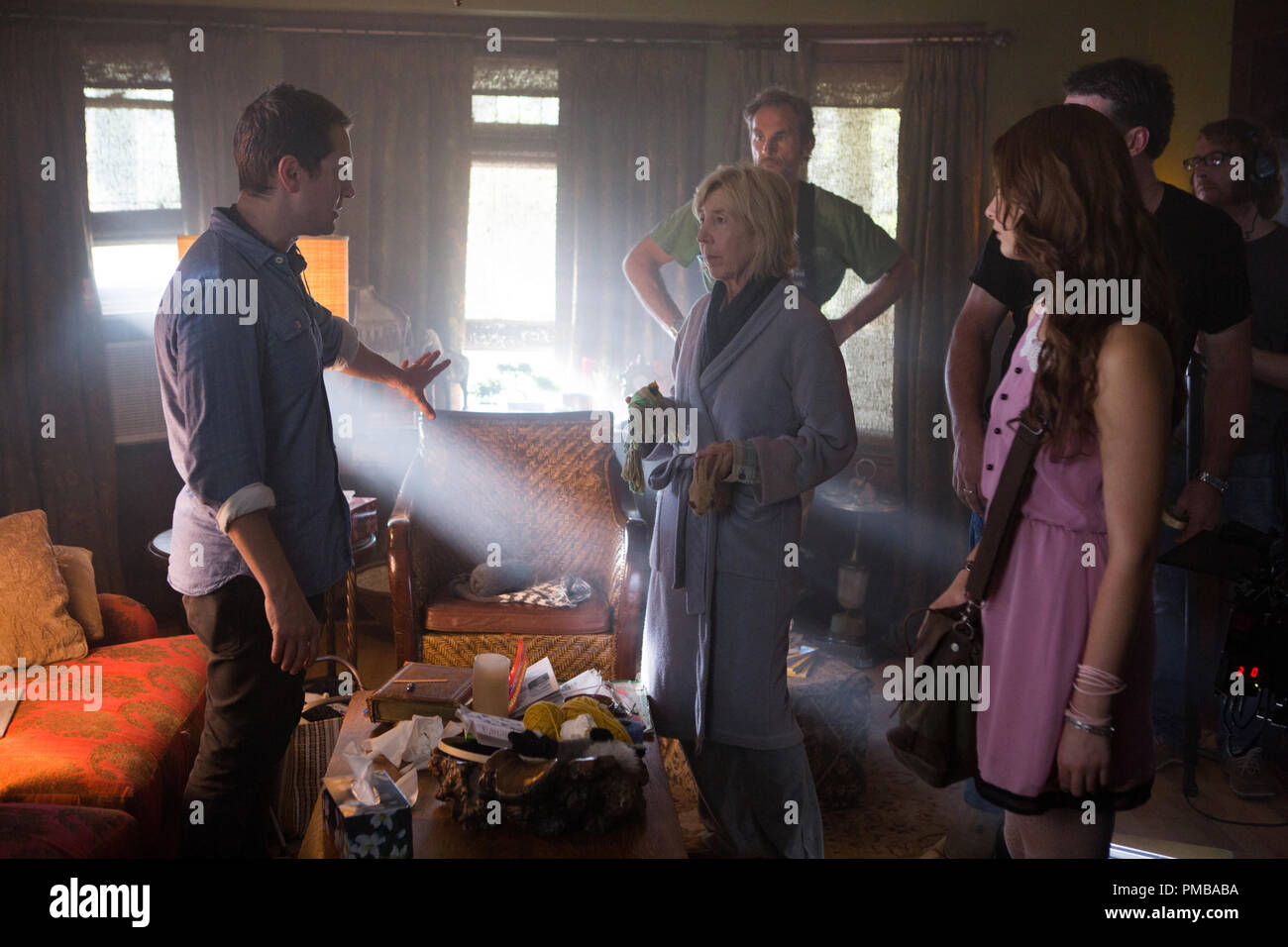 Director Leigh Whannell (left) discusses a scene with actress Lin Shaye on the set of Gramercy Pictures' 'INSIDIOUS: CHAPTER 3' (2015) Stock Photo