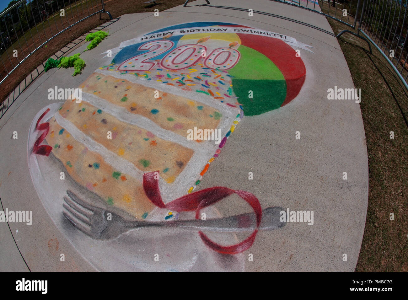 Chalk art covers part of a sidewalk at a public park at the Lawrenceville Arts Fest on April 28, 2018 in Lawrenceville, GA. Stock Photo