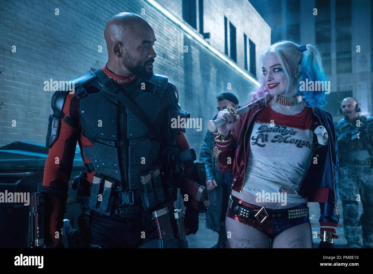Caption: (L-r) WILL SMITH as Deadshot and MARGOT ROBBIE as Harley Quinn in Warner Bros. Pictures' action adventure 'SUICIDE SQUAD,' a Warner Bros. Pictures release. Stock Photo