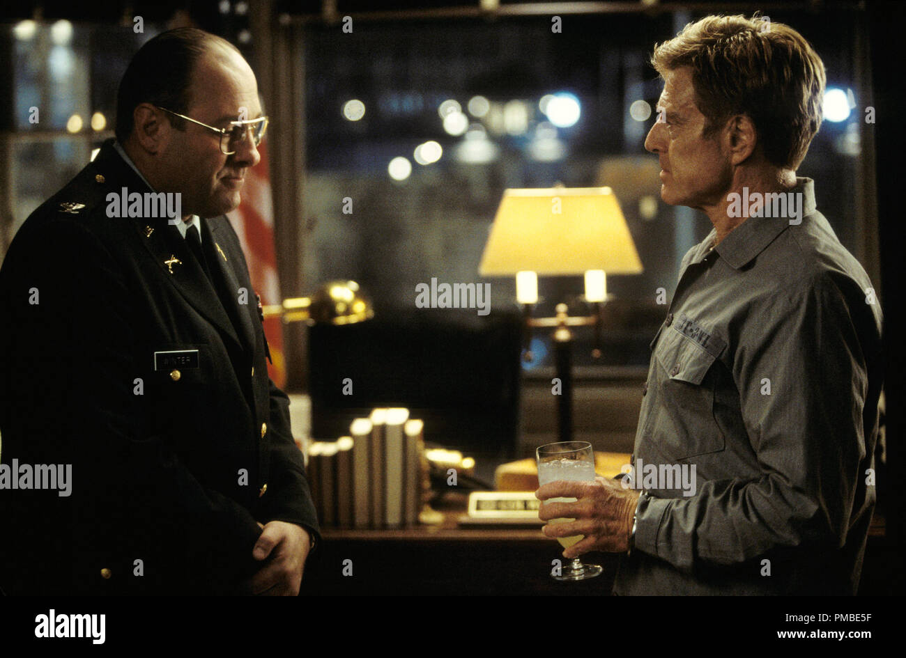 Prison warden Colonel Winter (JAMES GANDOLFINI, left) greets courtmartialed General Irwin