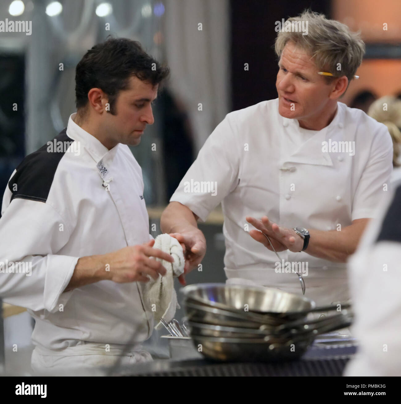 HELL'S  KITCHEN: Chef Ramsay (R) directs contestant Scott (L) during dinner service in the all-new '4 Chefs Compete' episode of HELL'S KITCHEN Stock Photo