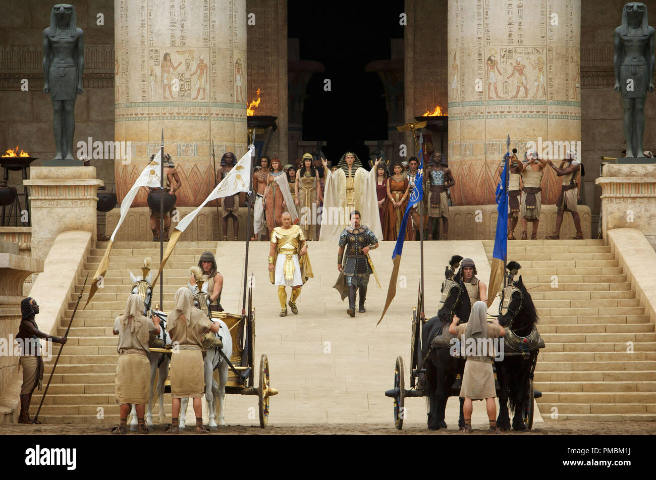 'Exodus: Gods and Kings' (2014) Seti (John Turturro, background) presents the future leaders of Egypt: Ramses (Joel Edgerton, left) and Moses (Christian Bale). Stock Photo