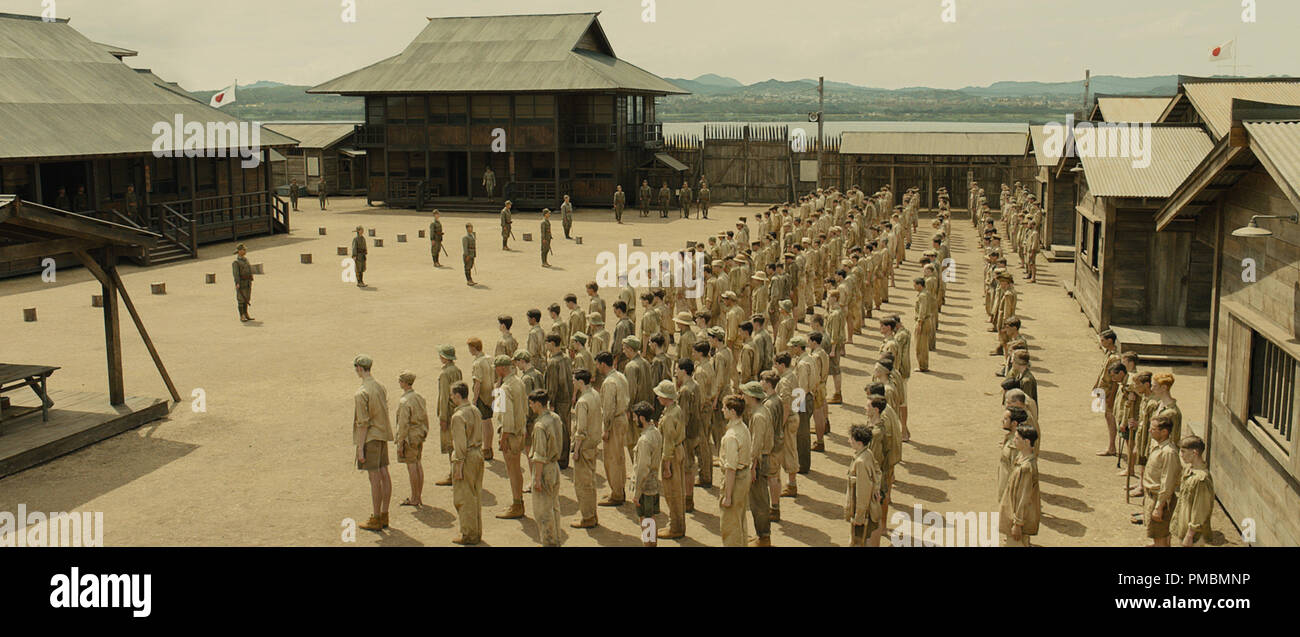 The Allied prisoners are lined up in formation in the Omori POW camp in "Unbroken" Stock Photo