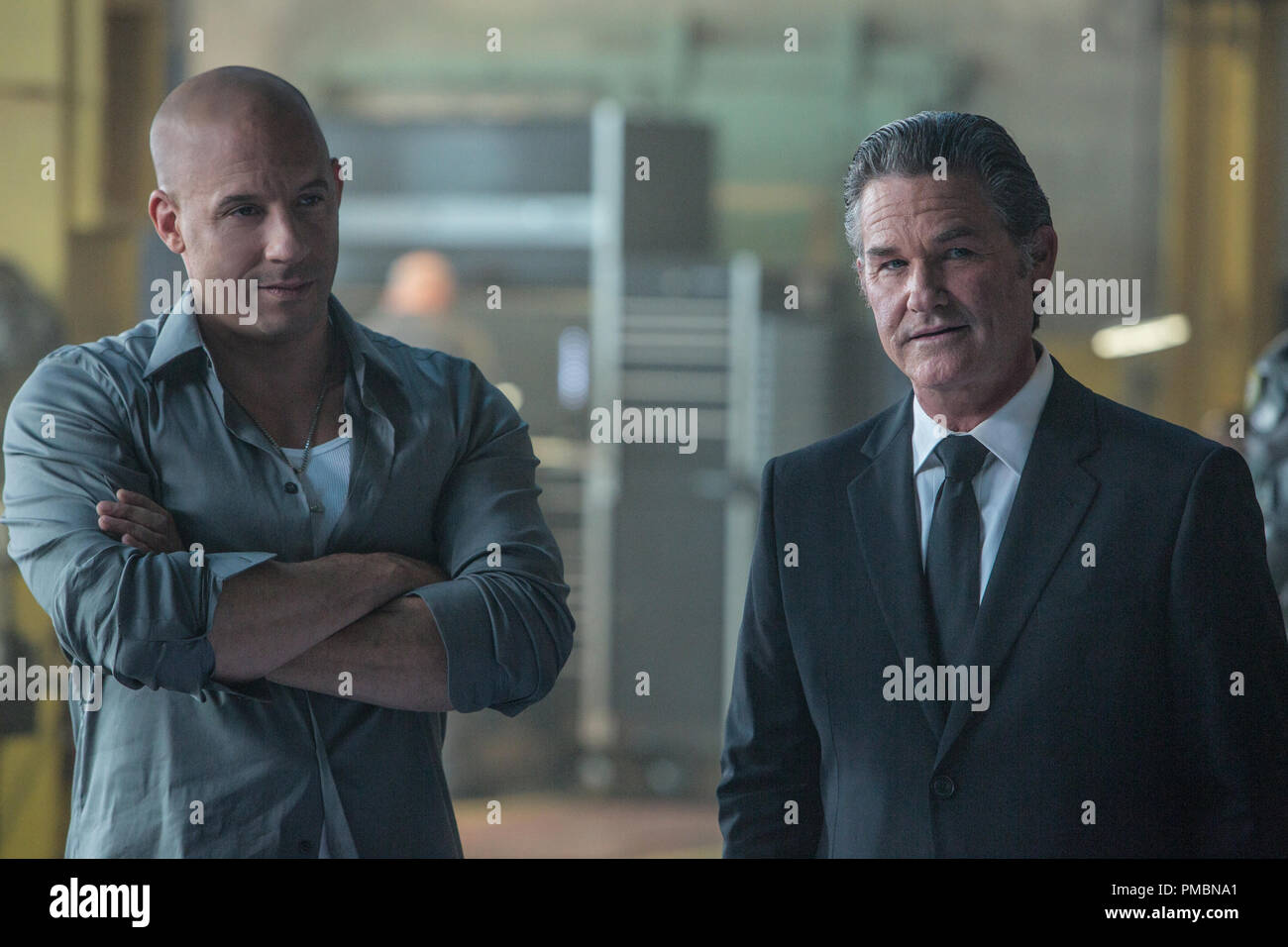 (L to R) Dom (VIN DIESEL) discusses the mission with a high-level government operative (KURT RUSSELL) in 'Furious 7'. Continuing the global exploits in the unstoppable franchise built on speed, James Wan directs this chapter of the hugely successful series. Stock Photo