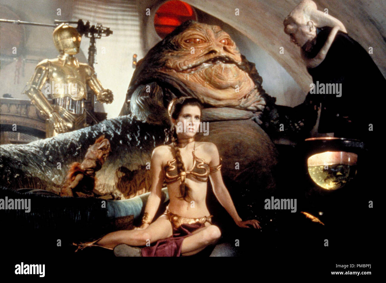C-3PO, Jabba the Hutt, and Princess Leia in 'Star Wars: Episode VI: Return of the Jedi' (1983)  File Reference # 32603 488THA Stock Photo