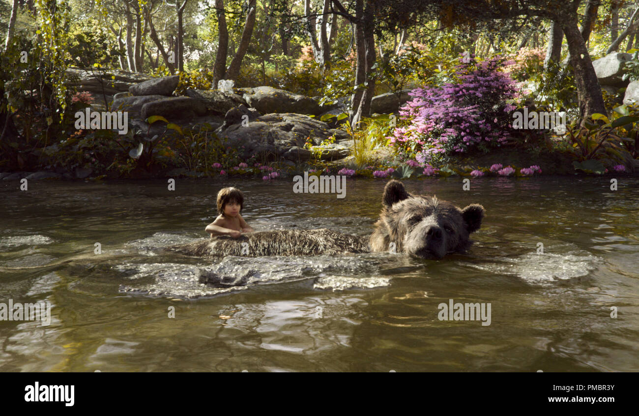 THE JUNGLE BOOK (Pictured) MOWGLI and BALOO. ©2016 Disney Enterprises, Inc. All Rights Reserved. Stock Photo