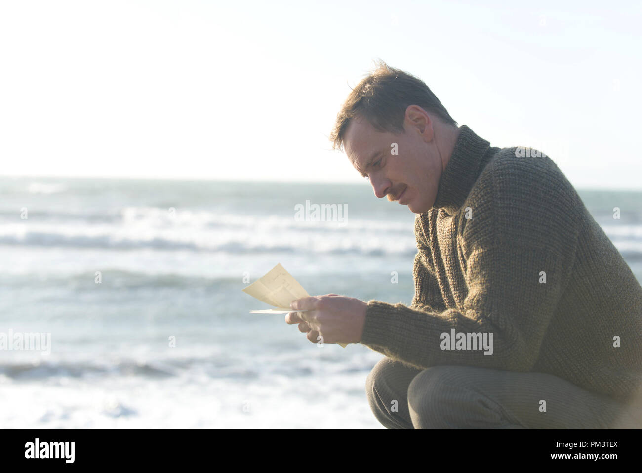 Michael Fassbender stars as Tom Sherbourne in DreamWorks Pictures' poignant drama THE LIGHT BETWEEN OCEANS, written and directed by Derek Cianfrance based on the acclaimed novel by M.L. Stedman. Stock Photo