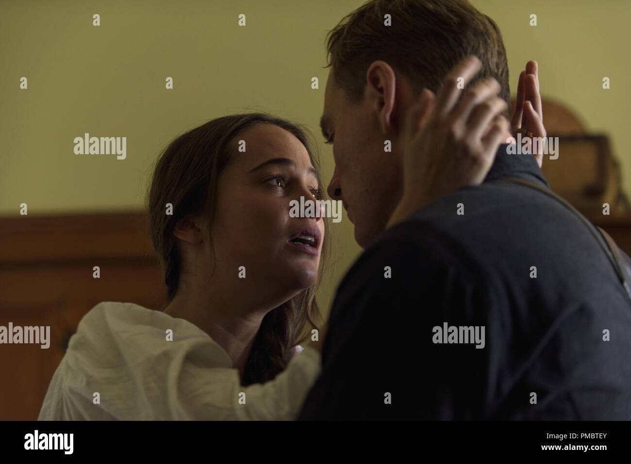 Michael Fassbender is Tom Sherbourne and Alicia Vikander is Isabel in the poignant THE LIGHT BETWEEN OCEANS, written and directed by Derek Cianfrance and based on the acclaimed novel by M. L. Steadman. Stock Photo