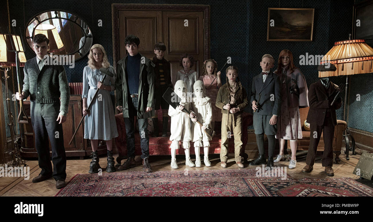 The residents of MISS PEREGRINE'S HOME FOR PECULIAR CHILDREN ready themselves for an epic battle against powerful and dark forces. Left to right: Enoch (Finlay Macmillan), Emma (Ella Purnell), Jake (Asa Butterfield), Hugh (Milo Parker), Bronwyn (Pixie Davies), the twins (Thomas and Joseph Odwell), Claire (Raffiella Chapman), Fiona (Georgia Pemberton), Horace (Hayden Keeler-Stone), Olive (Lauren McCrostie), and Millard (Cameron King). Stock Photo