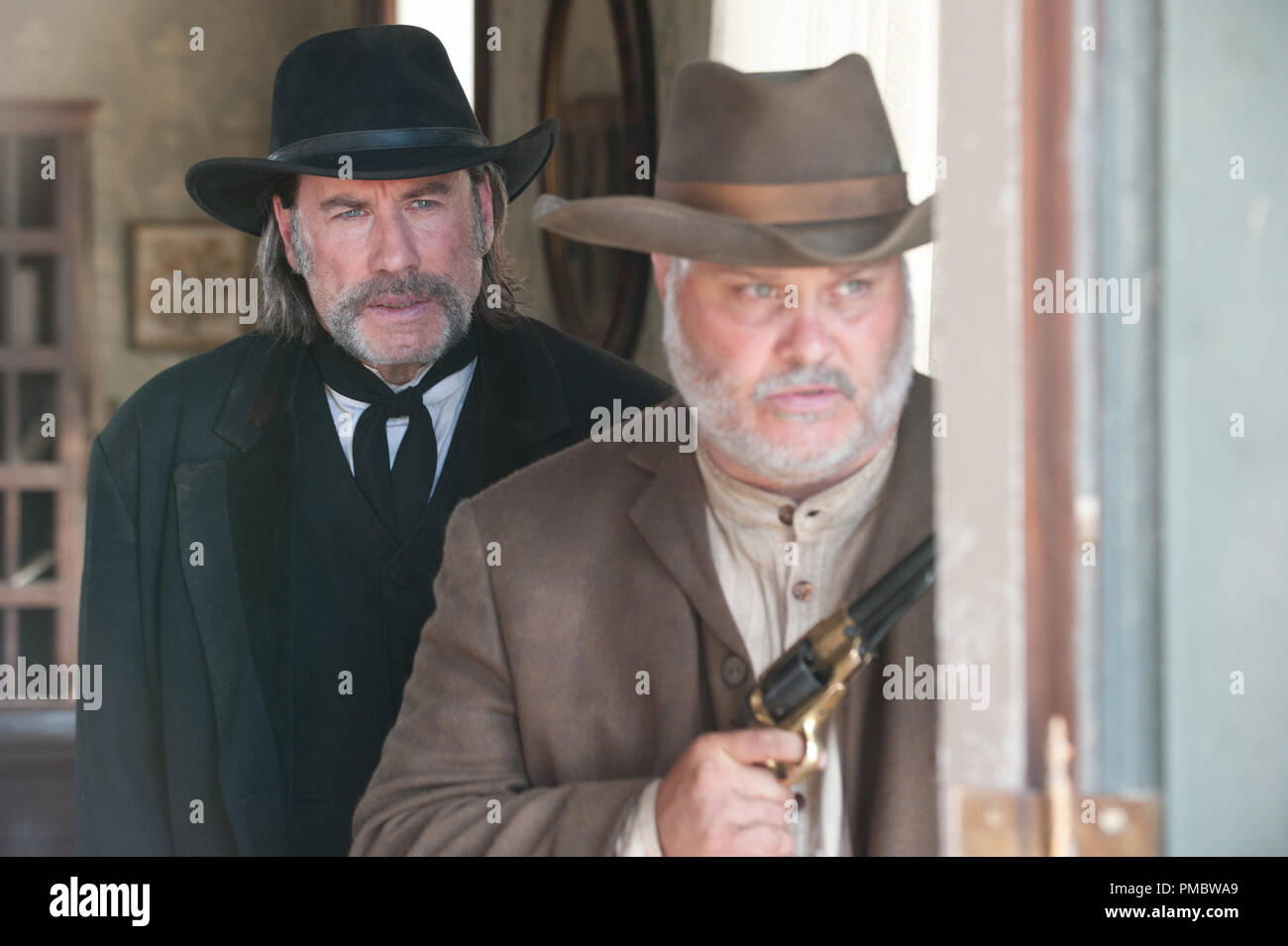 (L to R) John Travolta and Tommy Nohilly star in 'In A Valley Of Violence' (2016) Focus World Stock Photo