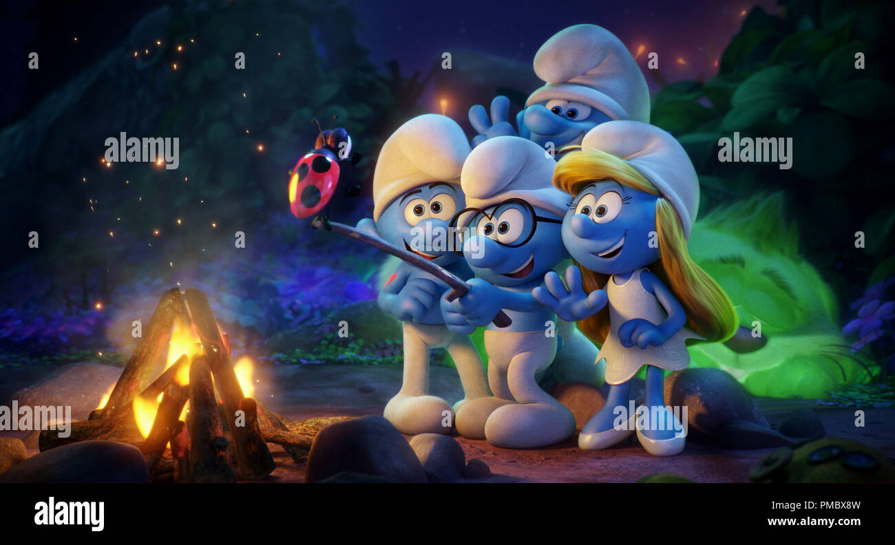 Hefty (Joe Manganiello), Brainy (Danny Pudi), Clumsy (Jack McBrayer) and Smurfette (Demi Lovato) use Snappy to take a selfie in Columbia Pictures and Sony Pictures Animation's SMURFS: THE LOST VILLAGE. (2017) Stock Photo