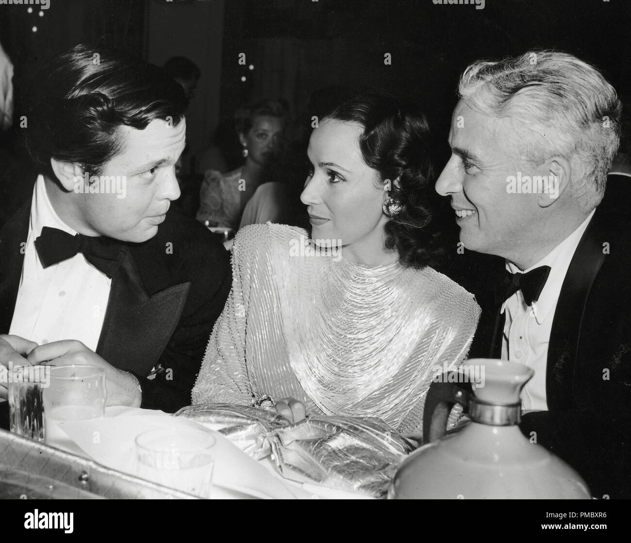 Orson Welles, Dolores Del Rio, Charles Chaplin, circa 1940  File Reference # 33300_070THA Stock Photo