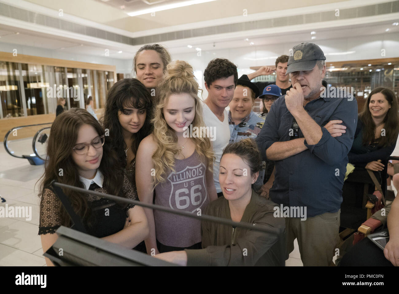 (L to R, foreground) GIDEON ADLON as Sam, GERALDINE VISWANATHAN as Kayla, MILES ROBBINS as Connor, KATHRYN NEWTON as Julie, GRAHAM PHILLIPS as Austin, director KAY CANNON and JIMMY BELLINGER as Chad in 'Blockers,' the directorial debut of Cannon (writer of the 'Pitch Perfect' series).  When three parents discover their daughters’ pact to lose their virginity at prom, they launch a covert one-night operation to stop the teens from sealing the deal. 2018 Universal Studios Stock Photo