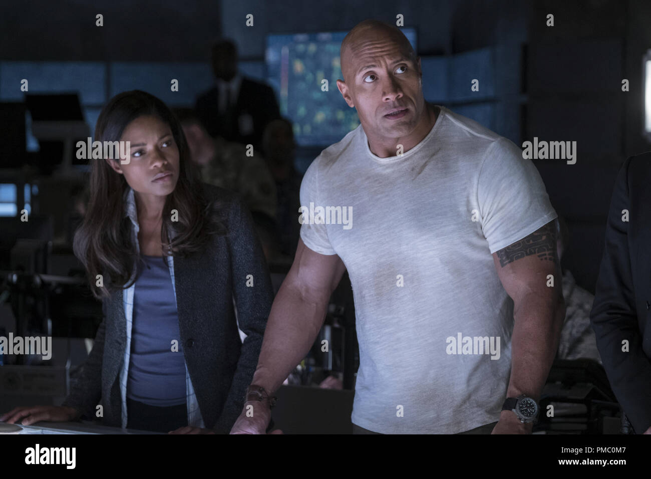 NAOMIE HARRIS as Dr. Kate Caldwell and DWAYNE JOHNSON as Davis Okoye in New Line Cinema's and ASAP action adventure "RAMPAGE," a Warner Bros. Pictures (2018 Stock Photo - Alamy
