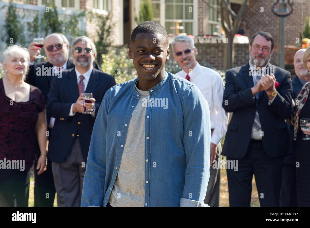 Chris Washington (DANIEL KALUUYA) is the guest of a very odd garden party in Universal Pictures’ “Get Out,” a speculative thriller from Blumhouse.  When a young African-American man visits his white girlfriend’s family estate, he becomes ensnared in a more sinister real reason for the invitation. (2017) Stock Photo