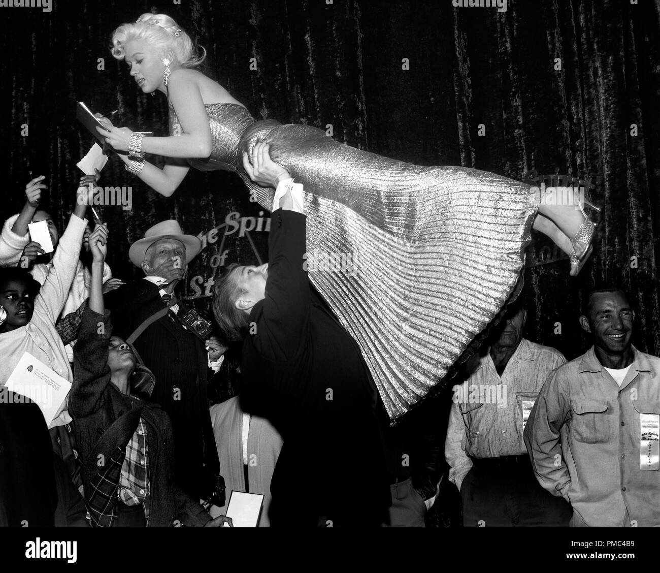 Jayne Mansfield and her husband Mickey Hargitay at a film premier circa 1957 File Reference # 33536 309THA Stock Photo