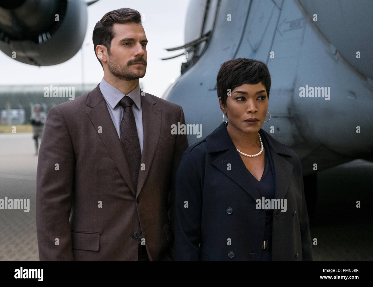 Left to right: Henry Cavill as August Walker and Angela Bassett as