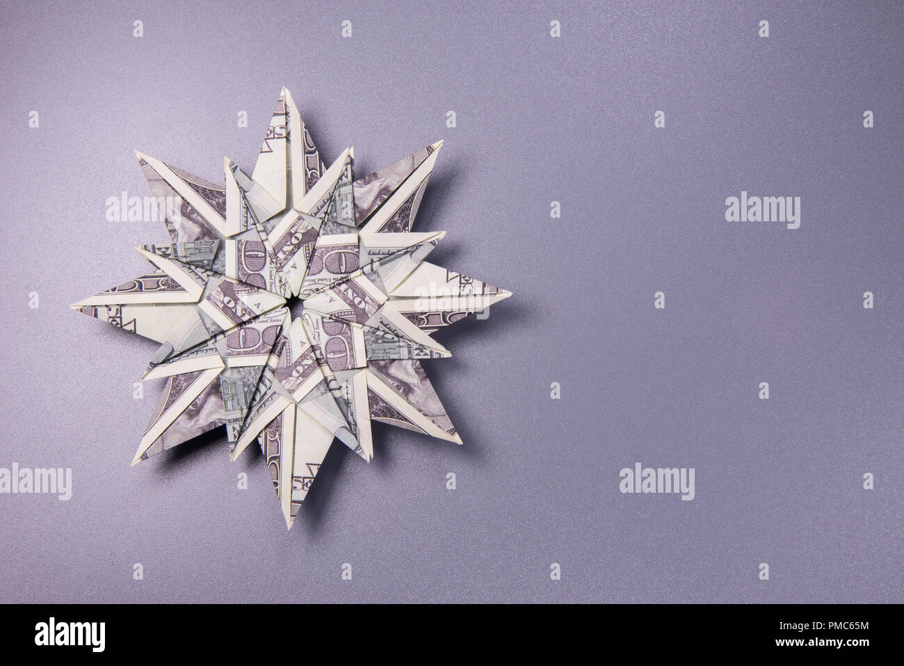 Money Origami snowflake Stock Photo - Alamy