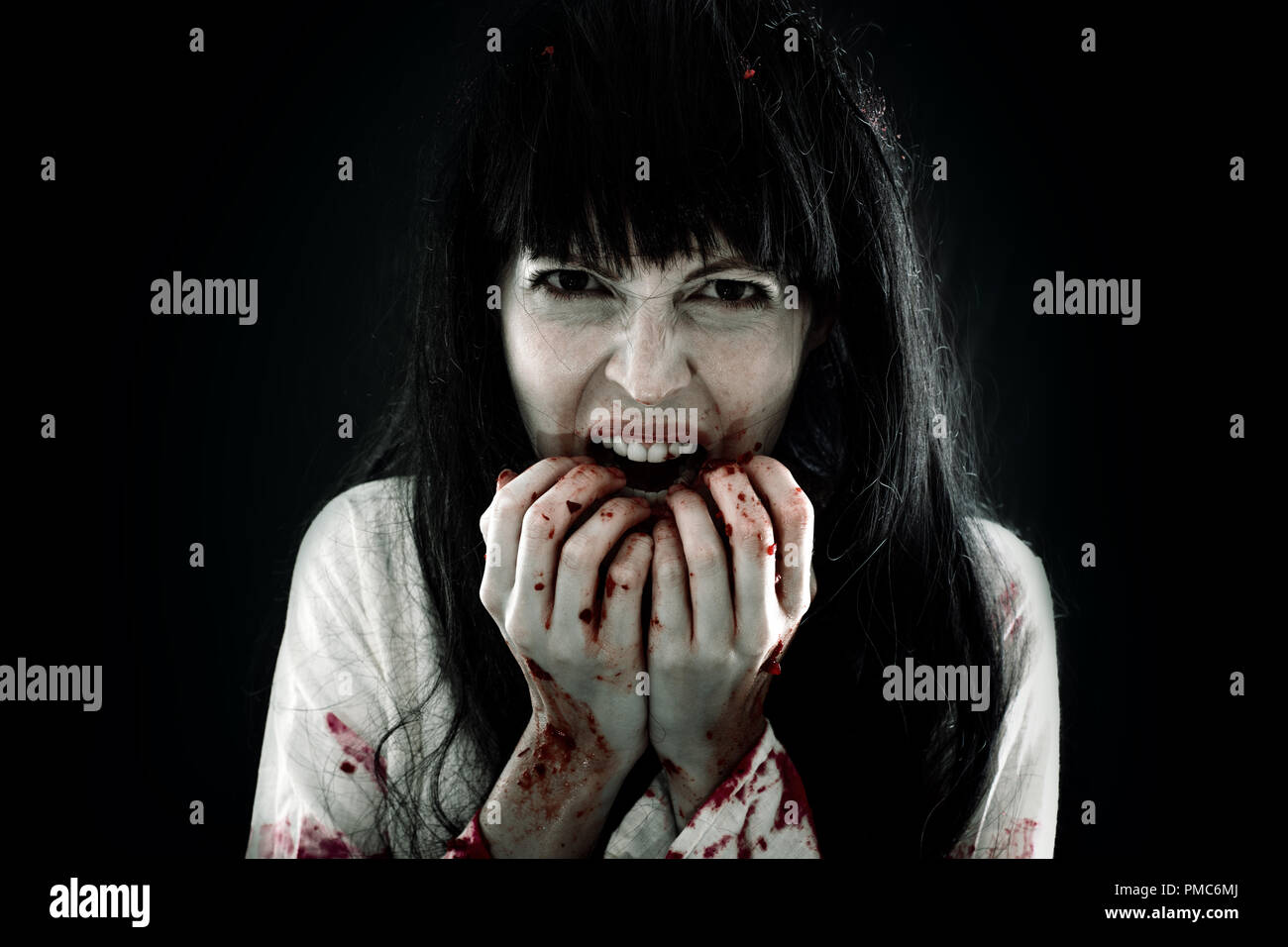 Halloween horror. Crazy bloody scary zombie woman Stock Photo - Alamy