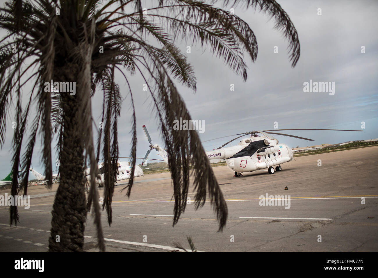 Helicopters are pictured on the runway of the Aden Abdulle airport inside the African Union Mission in Somalia (AMISOM) base in Mogadishu, Somalia, Au Stock Photo