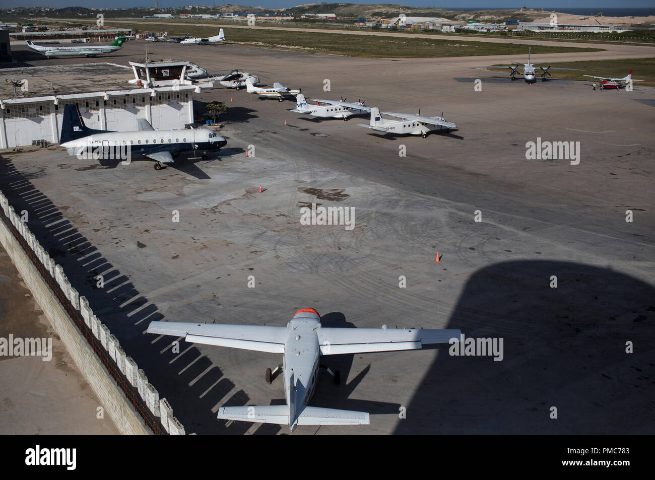 Aircraft is seen on the tarmac of the Aden Abdulle airport inside the African Union Mission in Somalia (AMISOM) base in Mogadishu, Somalia, August 9,  Stock Photo