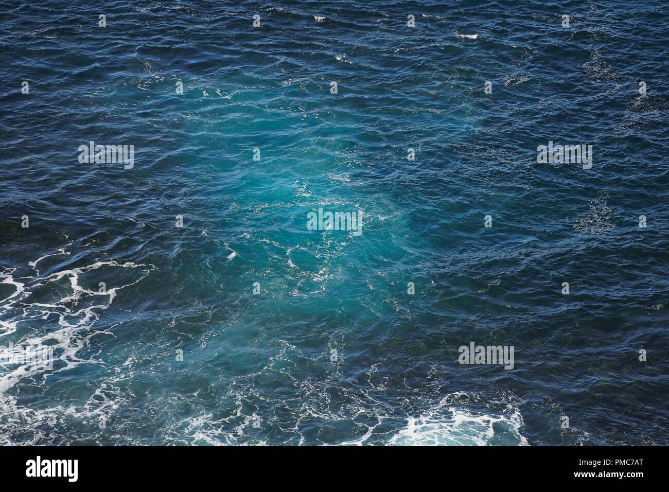 Sea water and seafoam, viewed from above and closeup. Stock Photo