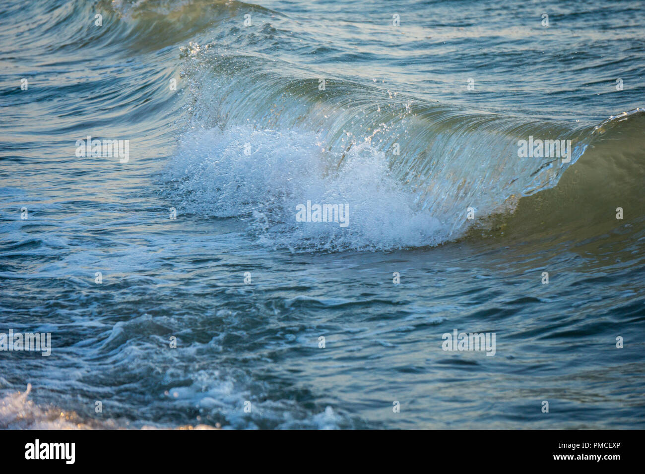 Small summer waves hitting hi-res stock photography and images - Alamy